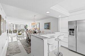 3212 S Ocean Blvd Unit 807-A, Highland Beach, FL 33487 - kitchen featuring recessed lighting, decorative light fixtures, modern cabinets, white cabinetry, and stainless steel refrigerator with ice dispenser
