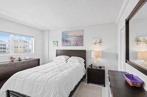 3212 S Ocean Blvd Unit 807-A, Highland Beach, FL 33487 - bedroom with a textured ceiling