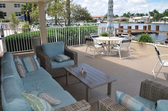 view of patio with a water view