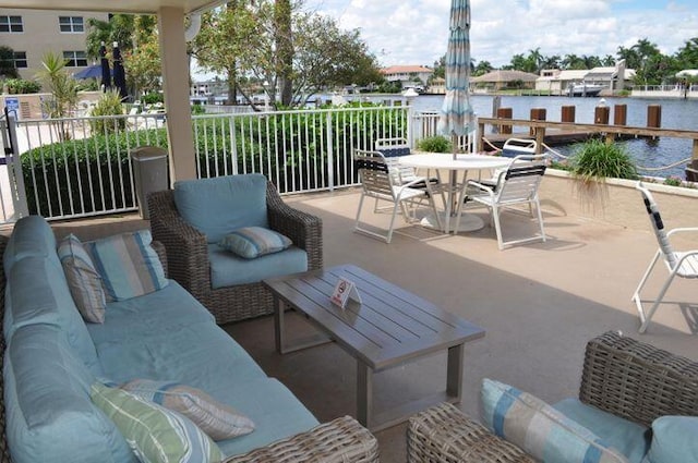 3212 S Ocean Blvd Unit 807-A, Highland Beach, FL 33487 - view of patio featuring a water view and outdoor dining area