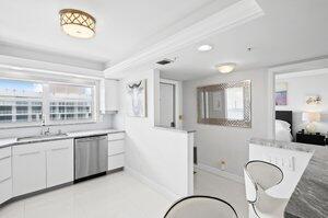 3212 S Ocean Blvd Unit 807-A, Highland Beach, FL 33487 - kitchen with dishwasher, a wealth of natural light, baseboards, and a sink