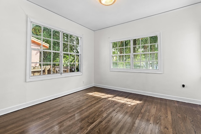 435 35th St, West Palm Beach, FL 33407 - spare room featuring dark wood finished floors and baseboards