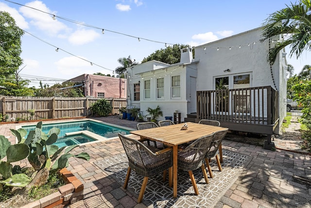 435 35th St, West Palm Beach, FL 33407 - view of pool with a patio, a fenced in pool, an in ground hot tub, and fence