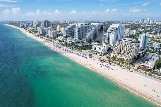 aerial view featuring a water view and a view of the beach