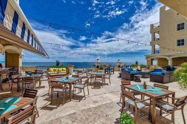 view of patio with a water view