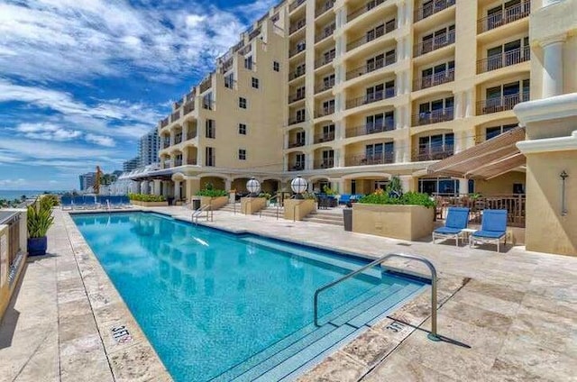 view of pool featuring a patio