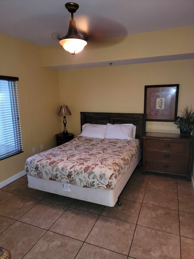 bedroom featuring tile patterned flooring and ceiling fan