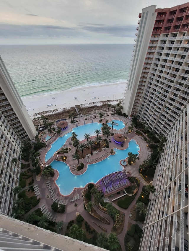 bird's eye view featuring a view of the beach and a water view