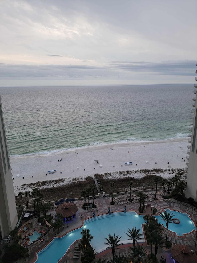 aerial view featuring a view of the beach and a water view