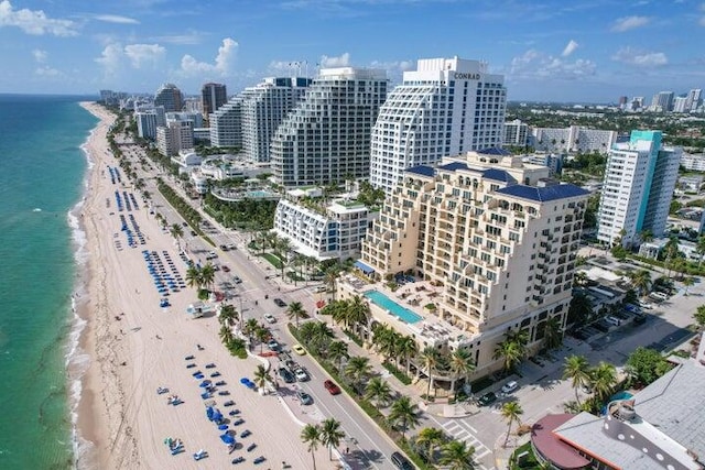 bird's eye view featuring a beach view and a water view