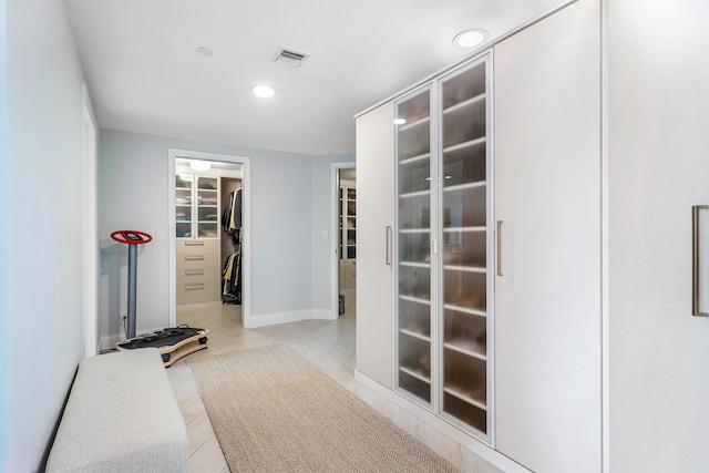 interior space with light tile patterned floors, baseboards, visible vents, and recessed lighting