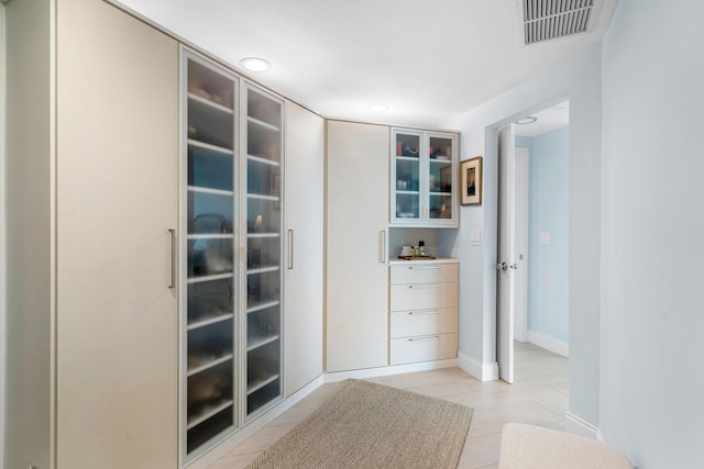 spacious closet featuring visible vents