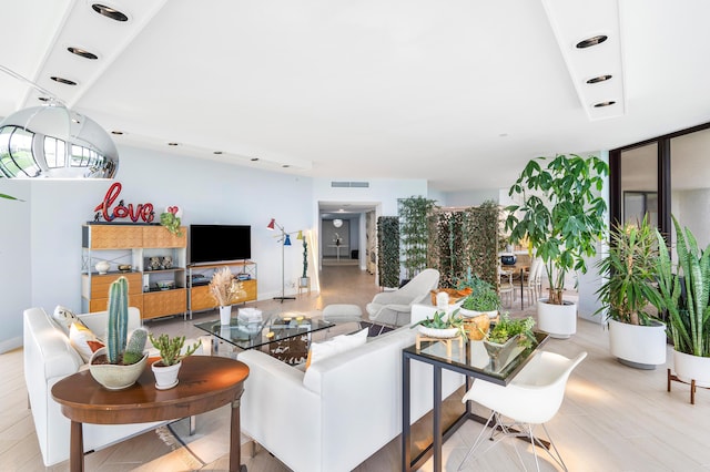 living area with visible vents and recessed lighting