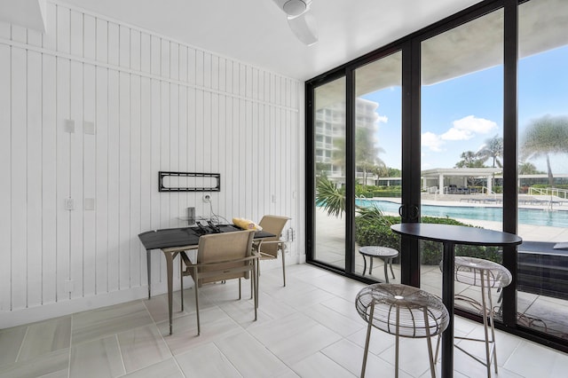 interior space featuring light tile patterned floors and floor to ceiling windows