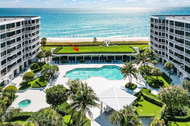 aerial view featuring a water view and a view of the beach