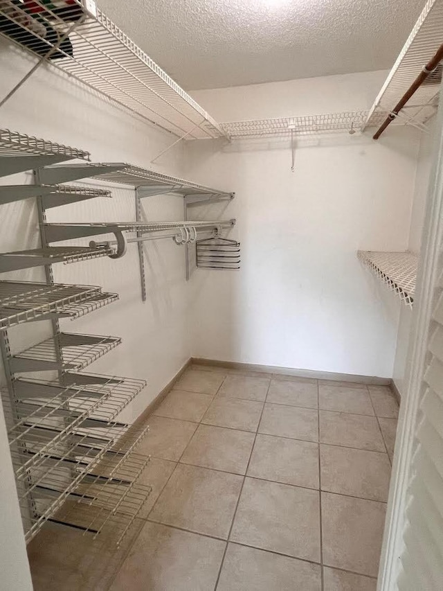 walk in closet featuring tile patterned floors