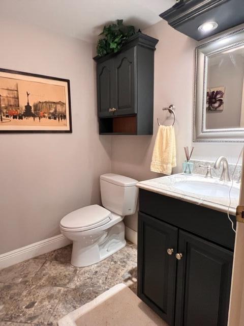 bathroom with toilet and vanity