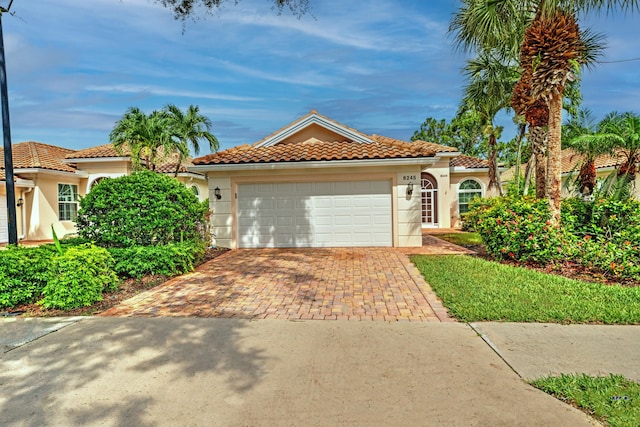 mediterranean / spanish-style home featuring a garage