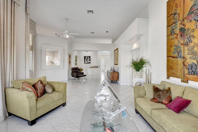 living room featuring light tile patterned flooring and ceiling fan