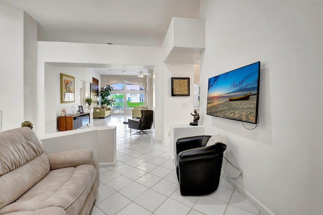 tiled living room featuring ceiling fan