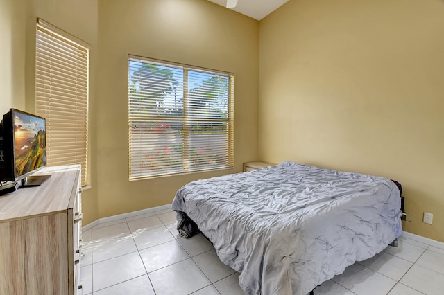 bedroom with light tile patterned floors