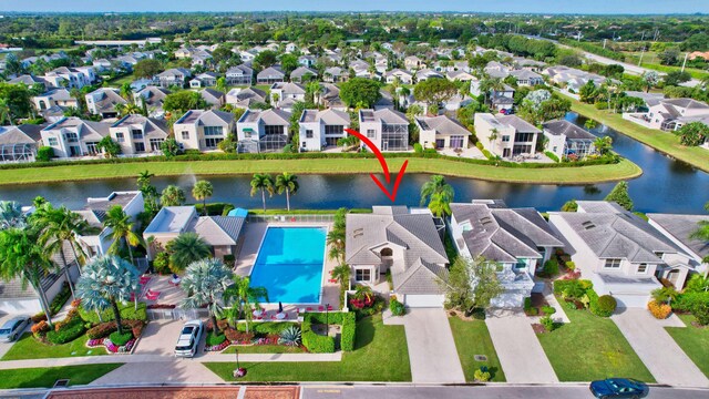 bird's eye view featuring a water view and a residential view