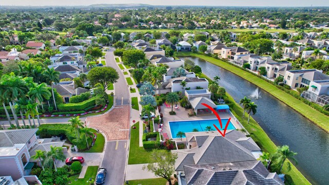 aerial view with a water view and a residential view