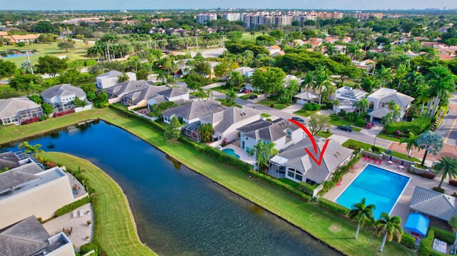 bird's eye view featuring a water view and a residential view