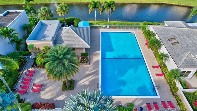 view of pool with a water view