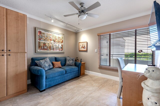 tiled office featuring ceiling fan, rail lighting, a textured ceiling, and crown molding