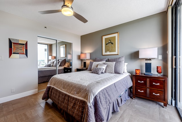 bedroom with ceiling fan, a closet, and a textured ceiling