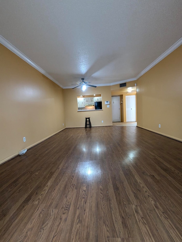 unfurnished living room with a textured ceiling, dark hardwood / wood-style floors, and crown molding