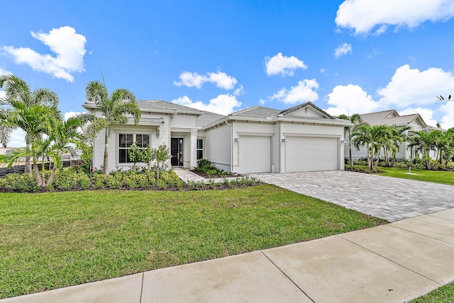 view of front of house featuring a garage and a front yard