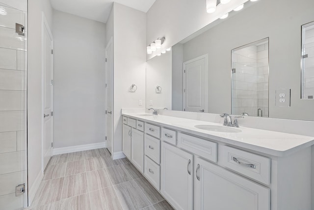 bathroom with dual vanity and tile patterned flooring