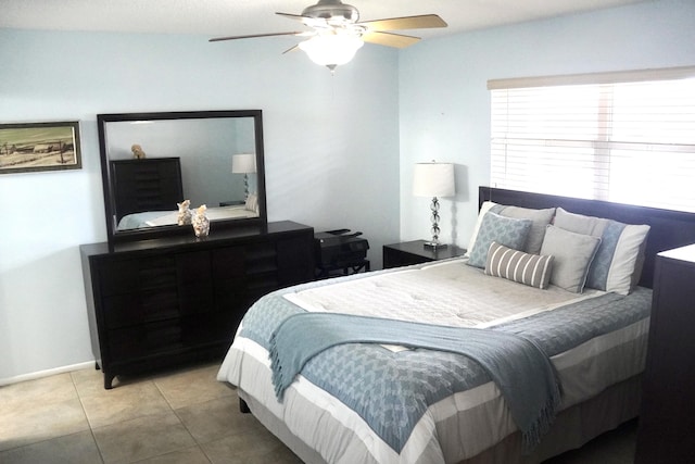 bedroom featuring ceiling fan and tile patterned flooring