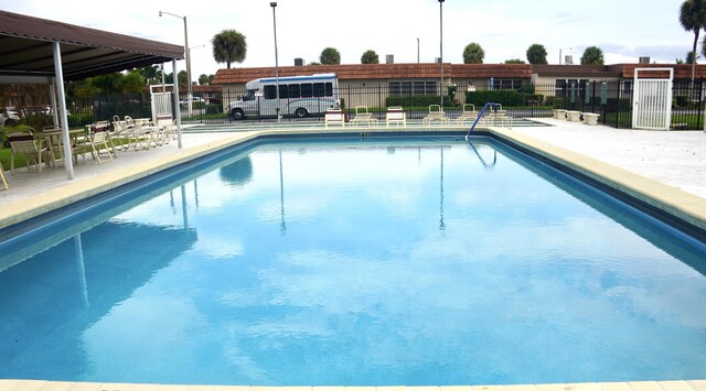 view of swimming pool featuring a patio area