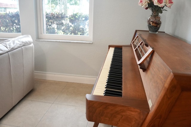 interior space with tile patterned floors and baseboards