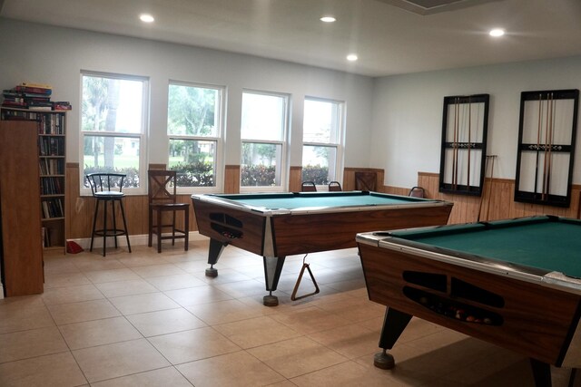 rec room featuring light tile patterned floors, billiards, and wooden walls