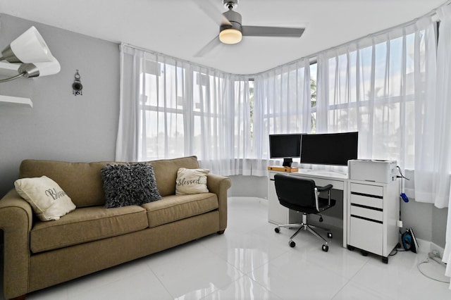 office space featuring light tile patterned floors and ceiling fan