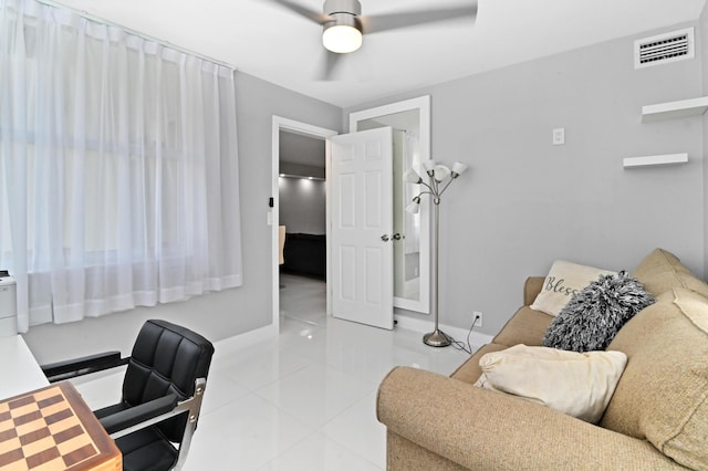 office space with ceiling fan and light tile patterned floors