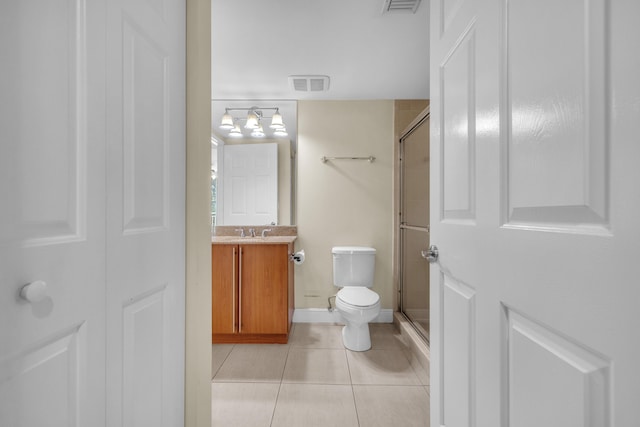 full bathroom featuring toilet, a stall shower, tile patterned flooring, and visible vents