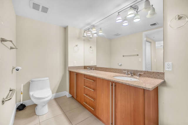 full bathroom featuring toilet, tile patterned flooring, visible vents, and a sink