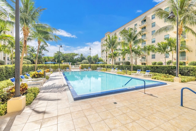 community pool with a patio area