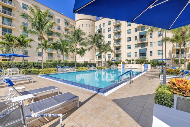 community pool with a patio area