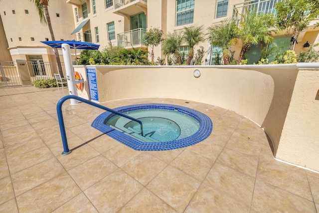 view of swimming pool featuring a community hot tub