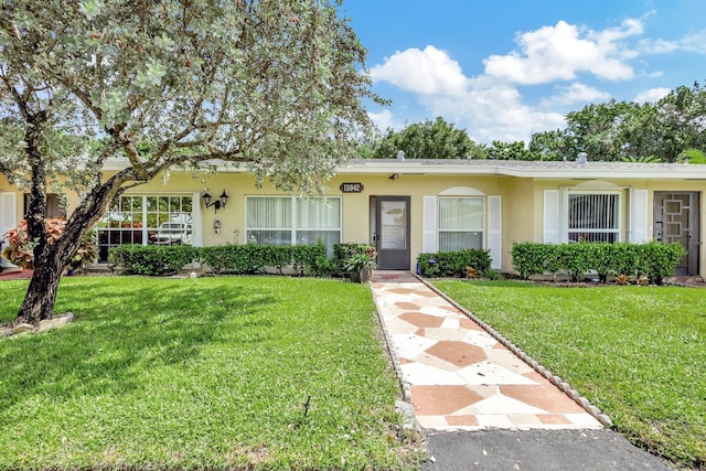 ranch-style home with a front yard