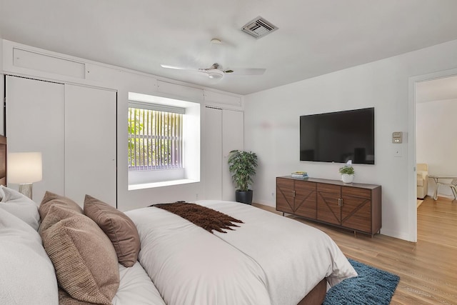 bedroom featuring light hardwood / wood-style floors and ceiling fan