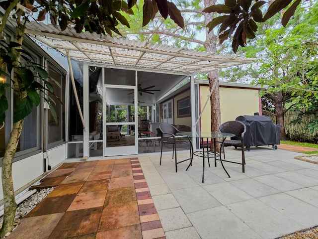 view of patio with a pergola, ceiling fan, and area for grilling