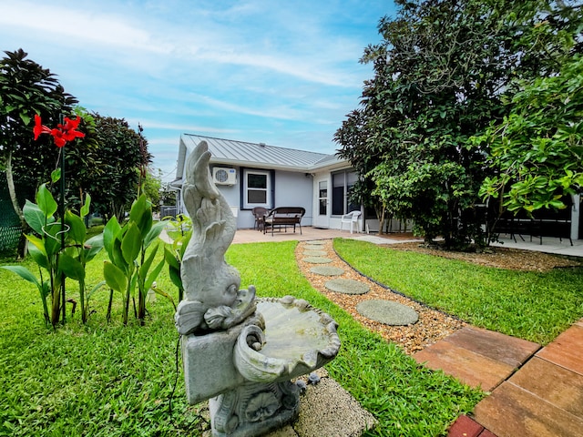 back of property featuring a patio area