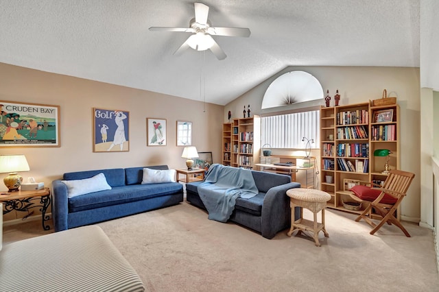 living room featuring vaulted ceiling, a textured ceiling, and light carpet